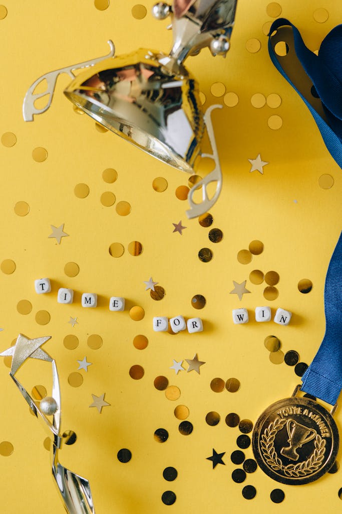 Gold trophy and medal with celebratory confetti and motivational message.